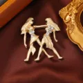 Exquisite matte gold Gemini brooch featuring sparkling rhinestones, elegant vintage design for women. - Gemini