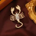Elegant matte gold scorpion brooch with sparkling rhinestones for women, stylish animal pin. - Scorpio