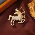 Matte gold centaur zodiac brooch with sparkling rhinestones, elegant clothing pin accessory. - Sagittarius