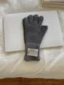 Detailed view of the dark grey knitted wool gloves, showcasing warm rib-knit cuff design. - One Size / Gray