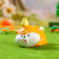 Close-up detail of cute fat Shiba Inu figurine with pear on head for car decor and desk display. - 19799 Drowsy Shiba Inu