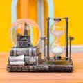 Detailed view of vintage Eiffel tower snow globe and rotating hourglass desktop ornament. - Electronic Luminous Eiffel Tower (SLB702) / 1 Piece / Silver