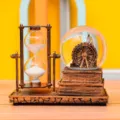 Retro bronze hourglass and Ferris wheel snow globe ornament close-up desktop decor detail. - Electronic Luminous Ferris Wheel (SLB703) / 1 Piece / Gold