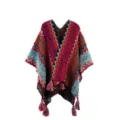 Colorful ethnic knit poncho shawl featuring vibrant geometric zigzag patterns and chic fringe tassels. - Rose Red