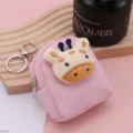 Close up detail of pink mini backpack coin purse with cute plush giraffe decor and metal keyring. - Pink with Giraffe