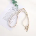 Beige replacement bag strap with gold metal clasps, adjustable minimalist shoulder accessory. - Lanyard / White
