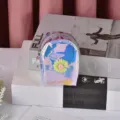 Holographic PU mini backpack coin purse featuring a cute daisy flower charm, perfect for daily use. - 6