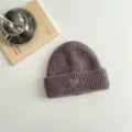 Children knitted beanie hat detail showing cute heart embroidery and soft wool texture. - Coffee Hat