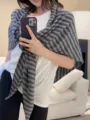 Detailed view of women's grey striped wool triangular scarf, cozy knit wrap for autumn winter. - Gray Striped / 70x160cm