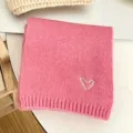 Pink knitted kids winter scarf detail with cute white heart embroidery, soft cozy texture. - Pink Scarf