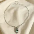 Collier hibou vert menthe chic avec chaîne florale délicate et pendentif en cristal scintillant. - Vert menthe