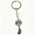 Cute grey cat metal keychain with movable tail, stylish anime style cartoon bag charm pendant. - Waving Tail Cat Keychain / Off-White