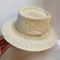 Detail shot of women summer raffia straw hat, vintage flat top wide brim sun hat. - M (56-58cm) / Beige