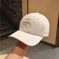 Detail view of beige baseball cap with embroidered letter R, casual sun protection design. - M (56-58cm) / Beige