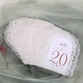 Detail shot of white laser cut wedding table number card, hollow arch design with table text. - Number Card-1 White 1-20
