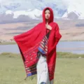 Detailed view of women's autumn winter ethnic style knitted hooded poncho cloak with tassels. - Double-Sided Ethnic Style Hooded Poncho, Red