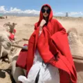Red hooded cloak for women, thick warm travel poncho blanket, stylish winter outerwear item. - Monochrome Light / Red