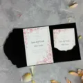 Elegant black laser-cut pocket wedding invitation set with pink floral sample cards - Black