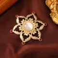 Vintage matte gold metal brooch with central white cat eye stone and red gems for women styling. - White Cat Eye