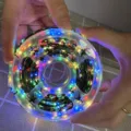 Colorful LED fairy string lights with star decorations on green copper wire, spool packed - 50m 500 LEDs 8-Function Adapter with Remote Control / Four Colors (Red, Green, Yellow, Blue)