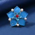 Detailed view of vintage blue enamel flower brooch featuring pearl accents and red stone center. - Double-Layer Bead Pentagon Flower Style / Blue