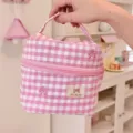 Pink plaid cosmetic bag detail view showing embroidered bow design and convenient top handle. - Pink Plaid
