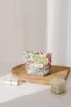Close-up detail of floral fabric cosmetic bag with exquisite embroidery and zipper. - Red Flowers Green Leaves / S