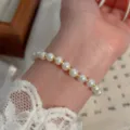 Pearl beaded bracelet, elegant gold bead accent, stylish women's wrist jewelry variant. - Alternating Pearl and Gold Bead Style (MY37147)