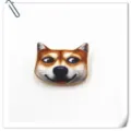 Close-up detail of the funny doge meme plush brooch, soft texture and cute facial expression. - Happy Shiba Inu