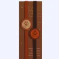 Detailed view of elastic PU leather book marker showing the cute paw print patch and backing card. - Paw