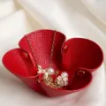 Detailed close-up of a red folding flower storage tray showcasing its premium texture and snap. - Red