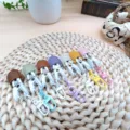Colorful mini clips with leather top and keychain hooks, neat display for daily use. - Purple