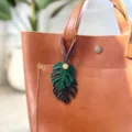 PU leather monstera leaf bag charm detail close-up showing double layer leaf keychain decor. - Leaf Lanyard Style