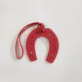 Red leather horseshoe bag charm stylish U-shaped pendant for handbags and purses. - Red