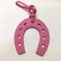Pink PU leather horseshoe bag charm, stylish U-shaped pendant with strap and stitching detail. - Rose Red