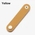 Yellow PU leather cable organizer strap with metal snap button for tidy earphone storage. - Yellow