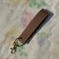 Brown PU leather wristlet keychain with gold metal hardware, durable strap for keys and bags. - Khaki