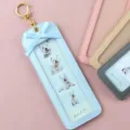 Detailed view of the light blue PU leather photo keychain with cute bow and 4-grid photos. - Sky Blue