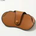 Portable PU leather sunglasses case with chic contrast stitching and secure snap button closure. - Brown