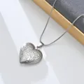 Stainless steel heart locket necklace with vintage floral engraved pendant, jewelry detail view. - Floral Relief (Style 4)