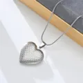 Detailed close-up of the vintage stainless steel heart locket pendant on fine chain. - Wavy Texture Locket (Style 11)