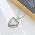 Detail of vintage silver heart locket pendant necklace with intricate floral engraving design. - Retro Floral Carving (Style 12)
