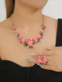 Elegant pink enamel camellia flower necklace and earrings set with sparkling rhinestones and pearls. - Pink Set
