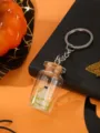 Halloween ghost bottle keychain detail view, cute mini glass jar pendant for spooky decor. - Plant Ghost Bottle - Green / Green Plant