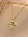 Close-up detail of the gold-plated Hamsa hand pendant necklace with sparkling zirconia stones. - Hamsa Hand Evil Eye (Style 10)