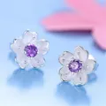 Close-up detail view of elegant cherry blossom stud earrings with sparkling purple crystal. - Sakura Stud Earrings (Purple Rhinestone) / Purple
