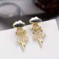 Chic gold-tone cloud and lightning drop earrings featuring sparkling cubic zirconia stones. - Black