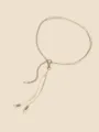 Close-up detail view of elegant metal chain and white leather cord belt for styling. - New Woven Waist Chain (1779) / White