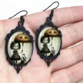 Gothic Halloween black oval earrings featuring eerie cute girl and pumpkin umbrella print. - Girls