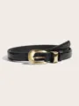 Detailed close-up view of the stylish black crocodile textured leather belt with gold buckle. - Two-Piece Set / Crocodile Pattern Black